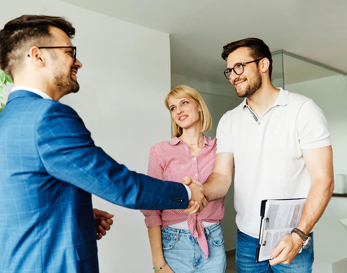 Couple selling to real estate agent